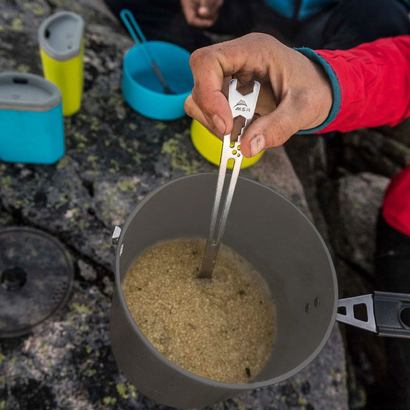 MSR Alpine Long Tool Spoon being used to stir food in MSR Trail Lite Pot