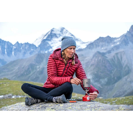 MSR Titan Cup 450mL in use in the Swiss Alps with camping stove
