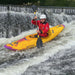 Person kayaking in rapids with a yellow kayak and helmet.